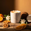 White marble-pattern candle jar with two lit wicks
