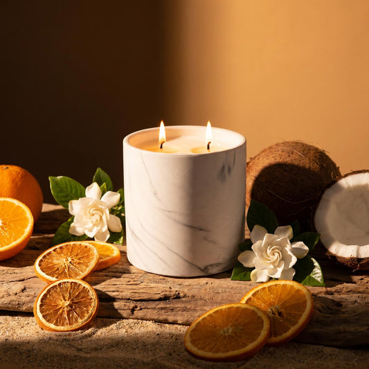 White marble-pattern candle jar with two lit wicks
