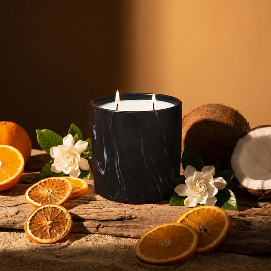 Black marbled jar candle with two flames and white wax, front view