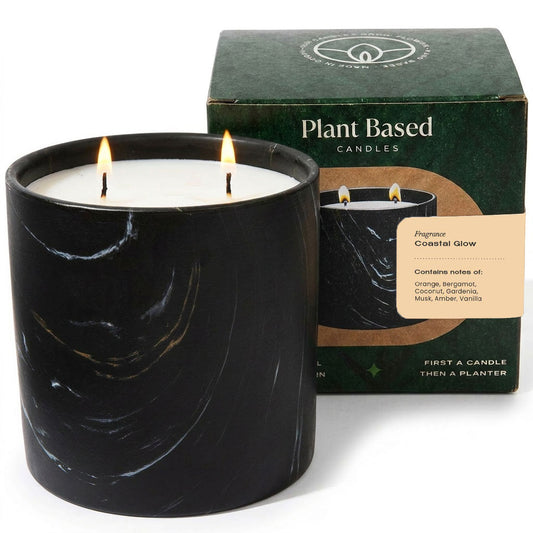 Black marbled candle with flame, plant-based label and Coastal Glow box