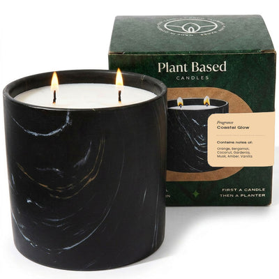 Black marbled candle with flame, plant-based label and Coastal Glow box