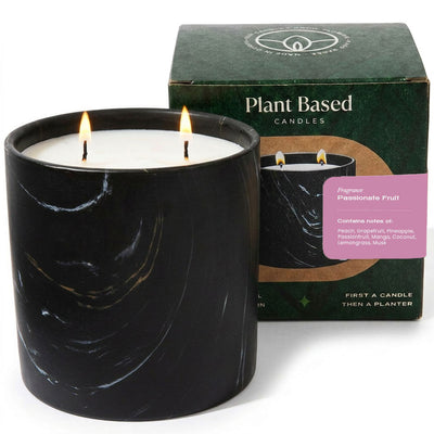 Black marbled candle jar with white wax and flame, with plant-based candle box.