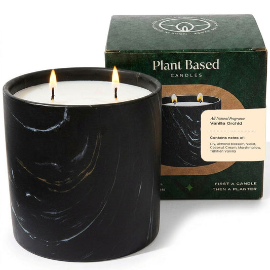 Black marbled jar candle with two flames; plant-based box behind