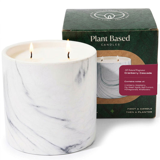 White marble-finish candle with two flames, 17oz, in plant-based candle packaging