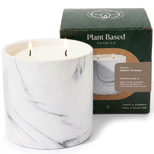 Plant-based candle in a white marble-pattern glass jar with two flames