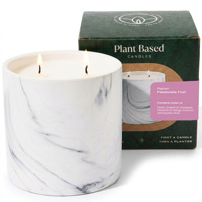 White marble-style soy candle in glass with two flames