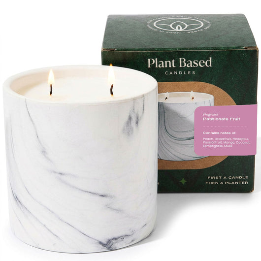 White marble-style soy candle in glass with two flames