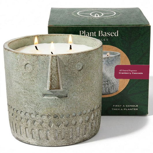 Gray stone-look face candle with three wicks in a round textured jar
