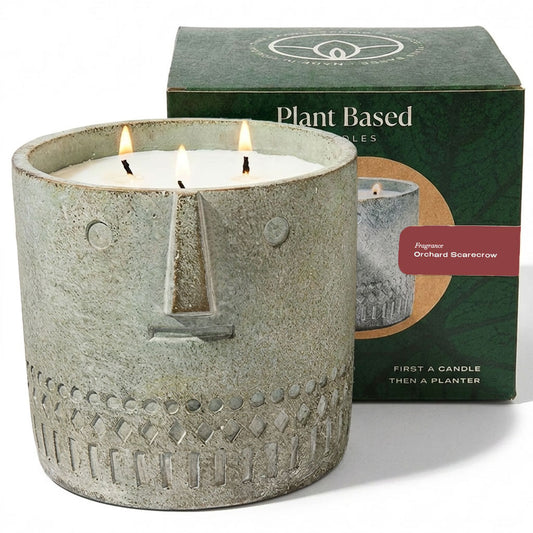 Stone-face candle in speckled gray container with label and Plant Based box