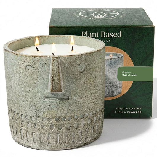 Stone-face candle, gray textured jar, three lit wicks, 27 oz