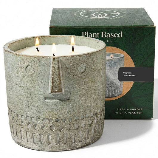Unscented stone face candle 27oz with textured gray jar and lit wick flames