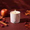 White marble 6 oz candle jar with lit wick