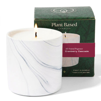 White marbled glass candle with steady flame