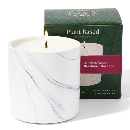 White marbled glass candle with steady flame