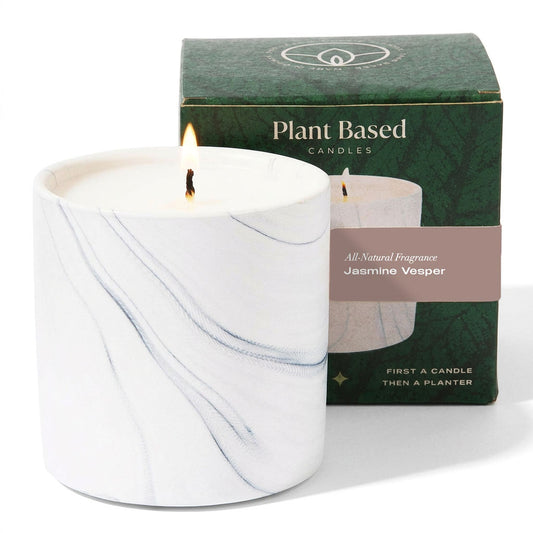 White marble jar candle with burning wick