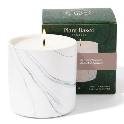 White marble jar candle with burning wick