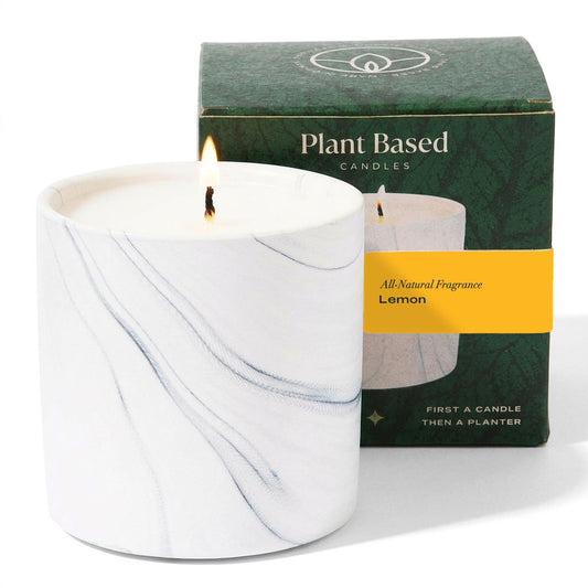 White marble-effect candle with gray veining and lit wick, with Plant Based Candles box
