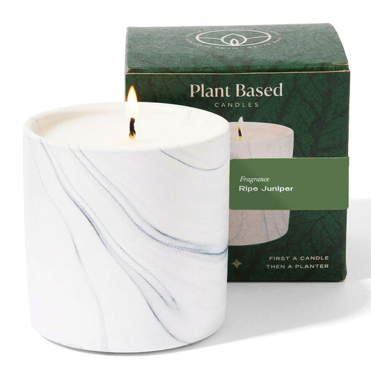 White marble candle with wick flames and green Plant Based Candles box.