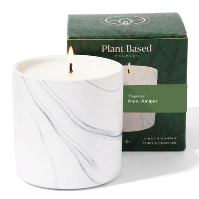 White marble candle with wick flames and green Plant Based Candles box.