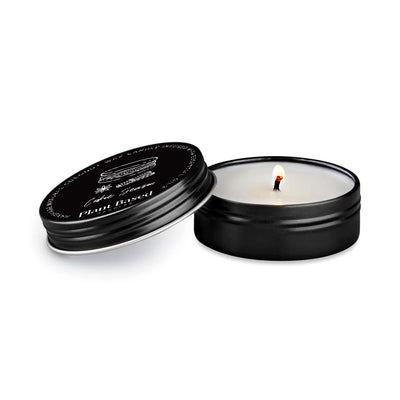Cookie Season tealight candle in black tin, lid open with small flame
