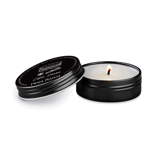 Cookie Season tealight candle in black tin, lid open with small flame