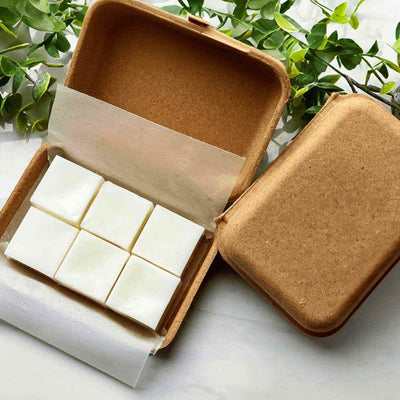 Box of white wax melt tarts, cube-shaped
